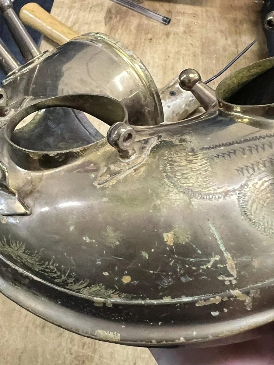 Engraved saxophone bell and bow with worn lacquer